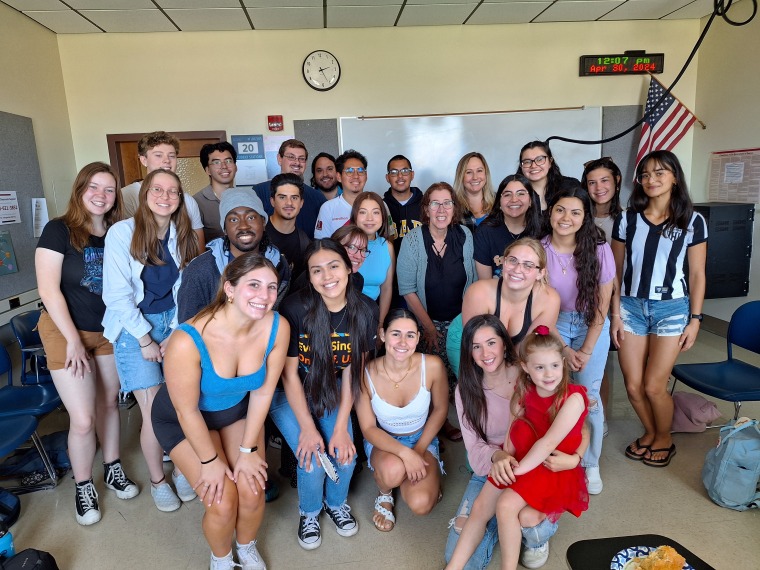 Image of Professor Bezerra with her Port 430 students