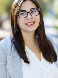 Photo of girl with brown hair and glasses 